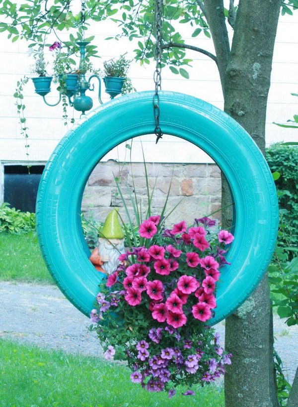 Hanging tire flower planter. 