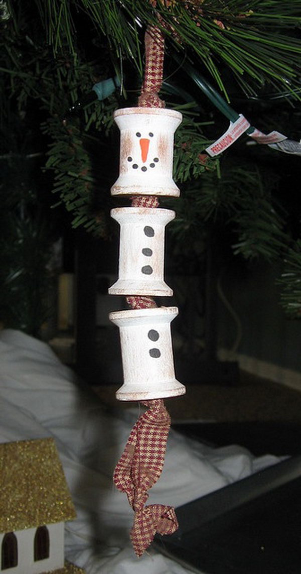 Wooden spool snowman ornament. Add charm to any Christmas tree or gift box, and make charming and thoughtful holiday presents for friends and family members.