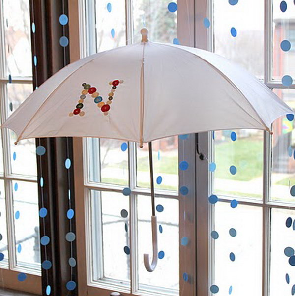 DIY craft using umbrella and buttons.