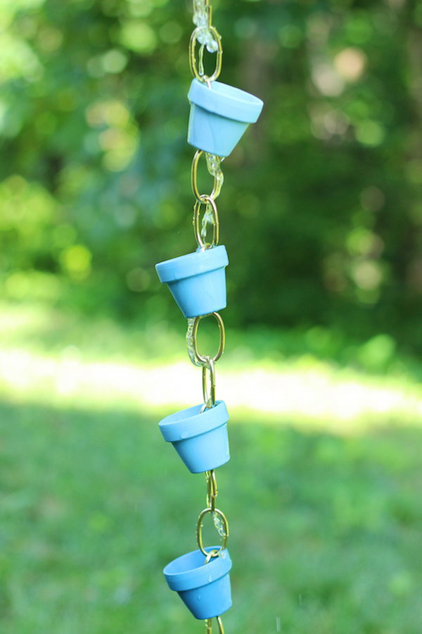 This DIY rain chain is made from small terra cotta pots   inexpensive, easy, and adorable! 