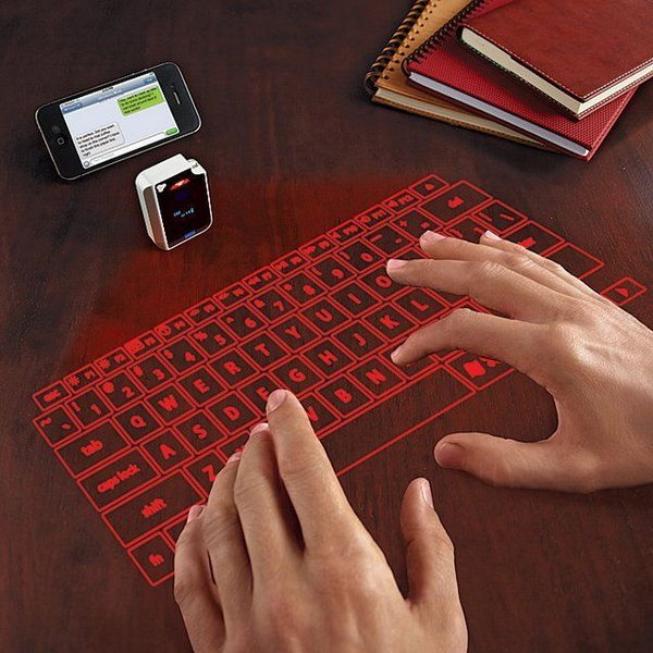 Virtual Keyboard From Brookstone. If you need a keyboard, this is the easiest carry along one. The laser projection keyboard can turn every surface into such a cool keyboard. Your desk is your keyboard! Could you ever image this before? 