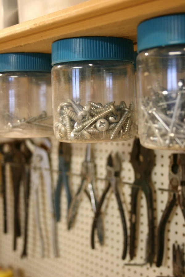 Hang Jars Under Shelves. Screw the jar lids into the wooden shelf that sits above the work top, and then screw the jar onto the mounted lid. Keep nails, screws and other small items out of the way and pretty organized.