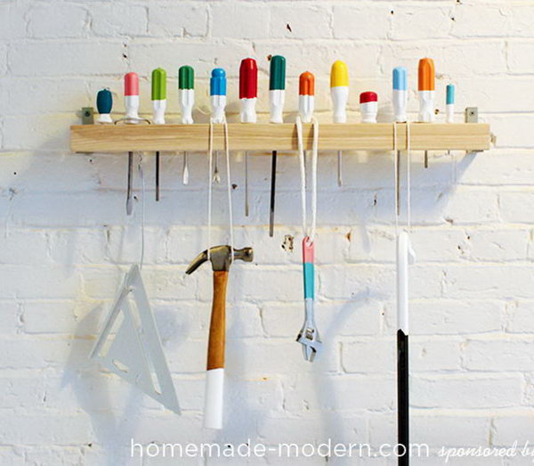 Screwdriver Coat Rack. Drill holes in a piece of wood and secure it to the wall with L Brackets.
