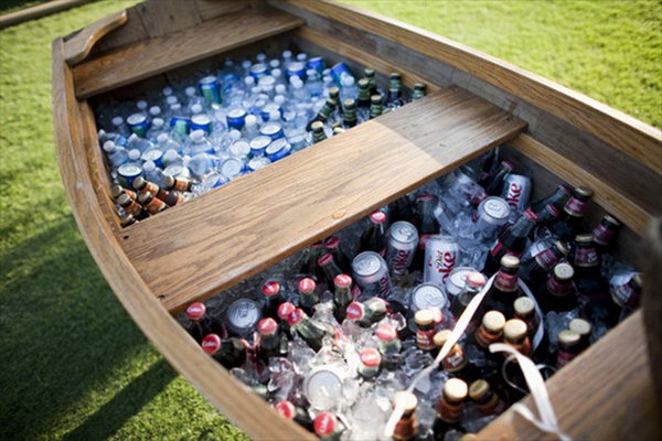 Mammoth Boat Drink Station. Rent a vintage boat and fill it with tons of ice and beverages to serve your guests for a gorgeous reception. This is also perfect for a rustic drink station design.
