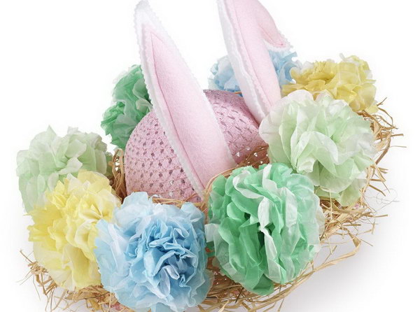 Rabbit Flower Pom Easter Bonnet. Secure raffia around the brim of your bonnet. Attach the ears to your bonnet and decorate it with fuller flower poms made of tissue paper of multi layers.
