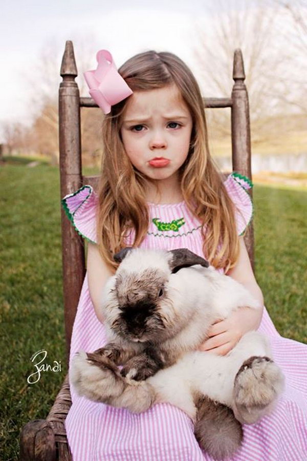 Adorable Easter Picture with Cute Expression. Sitting on a chair, hugging the bunny, whether you smile, laugh, cry or fell angry. Just snap the funny expression. It’s interesting to see your funny expression and you may wonder why you feel this way at that moment. 