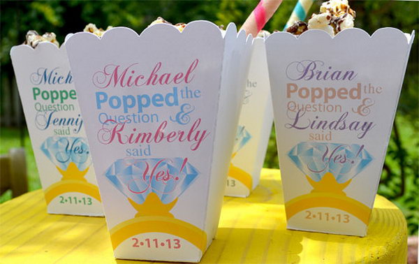 Engagement Party Popcorn Box Favors. Fill the celebration of the engagement party with caramel corn popcorn and wrap them in a cute gourmet popcorn bar for a party favor. You can personalize your favor with names written on them.