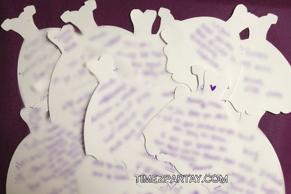 Dress Shaped Notes for Wedding Details Guess. Ask guests to write down their guesses of the details of the wedding day for the couple on these beautifully designed dress shaped cards. The one who guess the most right wins a special gift.