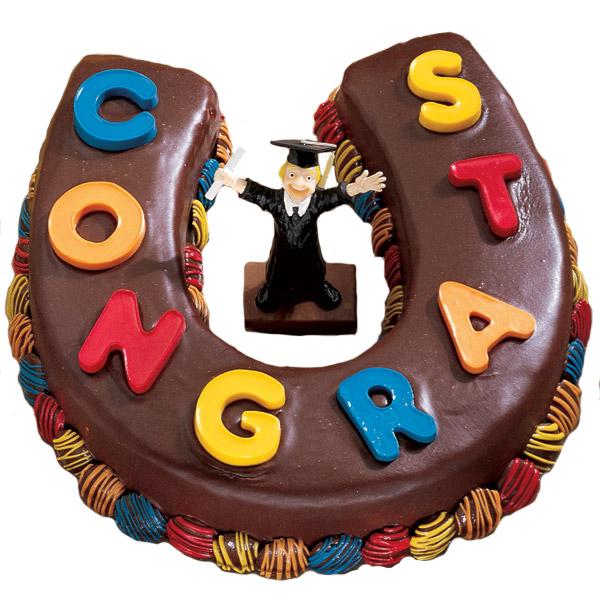 Congratulations All around Cake. Express your heartfelt congratulations to the graduate with this horseshoe shaped cake with chocolate coating and candy letters molding as well as a graduate in center.