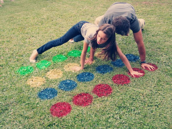 Outdoor Twister Graduation Party Idea. This game is the perfect addition to your graduation party for outdoor get together by using only 4 cans of colorful spray paint and 5 sheets of poster paper.