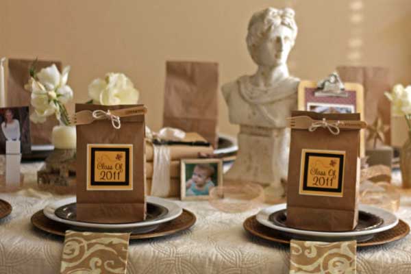 Through the Years Graduation Party. Use natural burlap ribbon wrapped around vases and a scholarly looking bust for the centerpiece decoration. I really adore the neutral color scheme to give the party a casual and reminiscent of school flavor.