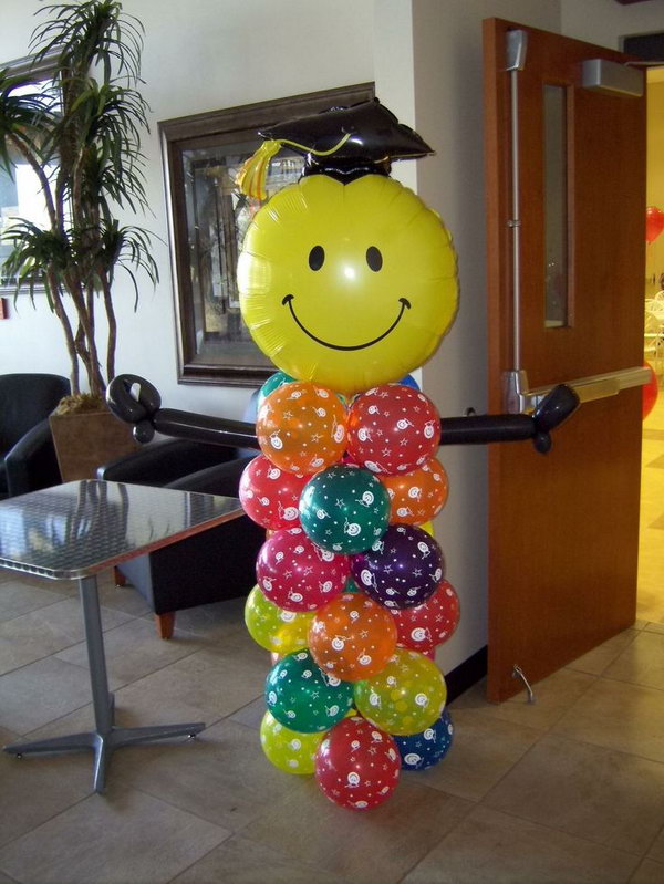 Graduation Balloon Decor. This graduation person made out of balloon is really stunning and eye catching. All you need is to put colorful balloons of various shapes together.