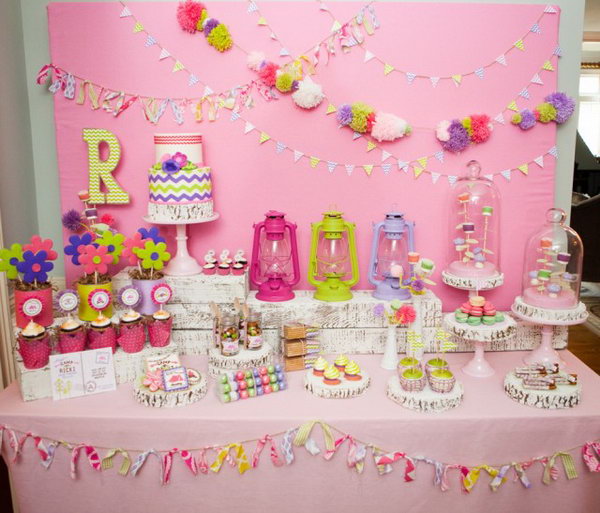 Glam Camping Party. The tassel and pom banner on the backdrop set up the tone for this party. With the glass jars for trail mix, polka dot balloons, lanterns, camp ricki pillowcases décor, it make this camping party an exciting project for you to follow. 