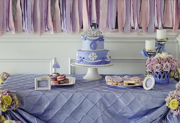 Sofia Inspired Princess Party. The dessert table backdrop, the glittering princess crown banners, princess dress food toppers and many other favors add up the romantic lavender flavor. 