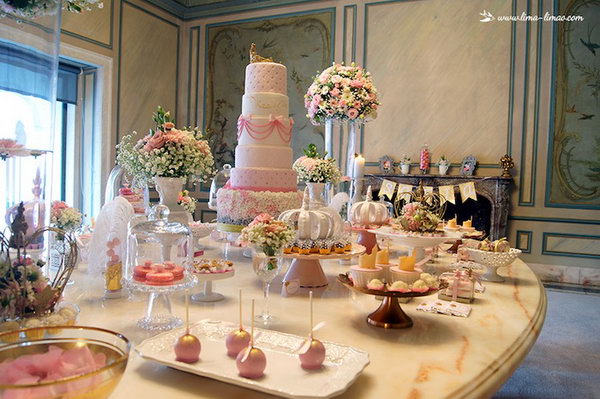 Gorgeous Princess Birthday Party. The gorgeous six tiered princess cake is really stunning with the beautiful floral arrangements setting around it. The cute gold and pink ruffled cake balls, mini stacked cakes with gold crowns and lace patterned favor boxes add up more elegant sense to the party spread. Seriously spectacular for such an event. 