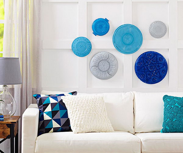 DIY Platter Wall Artwork. It's a fabulous and creative way to turn some crystal platters from the dollar store into a wall artwork.What you need to do is to paint the sides of the platters with some coats of paint in different colors, let them dry.Then match them together according to colors , sizes and patterns, hang them together in the wall.
