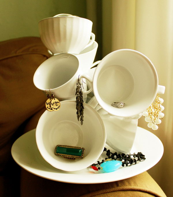 DIY Teacup Sculpture. Glue more teacups from the dollar store to an old plate so there would be more room for your necklaces and other random stuffs. It’ll cost you about five bucks. But it adds sort of gorgeous and luxurious atmosphere to your bedroom.