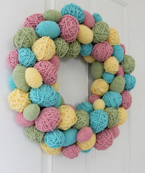 DIY Yarn Egg Wreath. I like this yarn egg wreath very much. They are so adorable. It looks great on the door or used as a party decor. It is also super easy to make. What you need is some yarns in different colors and plastic eggs in various sizes from the dollar store.