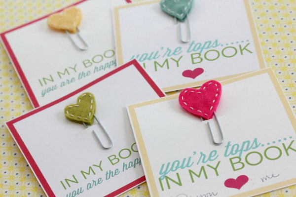 Adorable Stitched Heart Bookmarks. Use paperclips, white embroidery thread and colorful fabric to make these adorable stitched heart bookmarks as perfect gifts to all the book lovers in your life. See the details here.