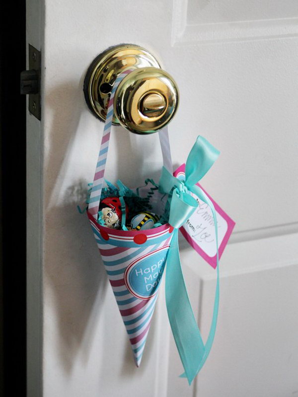 Merry May Cone. Use a craft paper base and include spun cotton mushroom, velvet millinery leaf, paper flower, vintage buttons , Blumchen butterflies and ribbons to creae this hanging upon the door knobs of friends spring offerings in the basket shape filled with flowers for a fresh spring outlook.