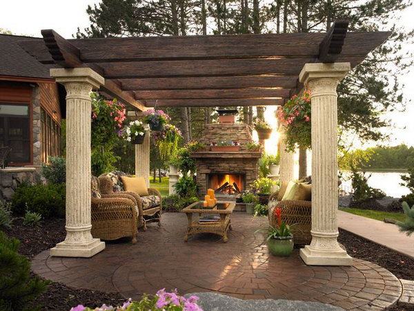 The traditional brick fireplace and the pergola made from wood are really nature friendly. It's not only a cooking place but also a nice comfortable seating area.