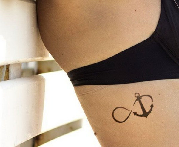 Woman with Infinity Symbol and Anchor Tattoo. 