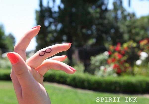 Simple Infinity Tattoo On Finger. 