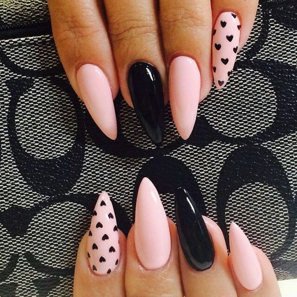 Black and Pink Stiletto Nails with Small Hearts Accent. 