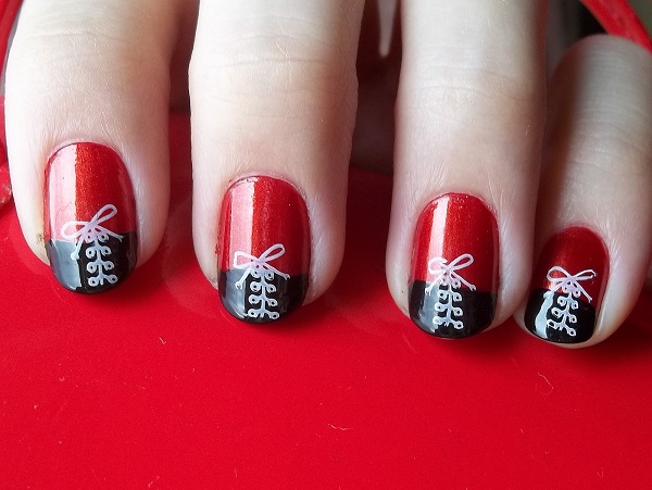 White Shoelace on Black and Red Nails.