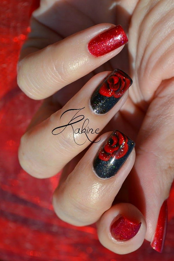 Diseño de uñas con rosas negras y rojas.