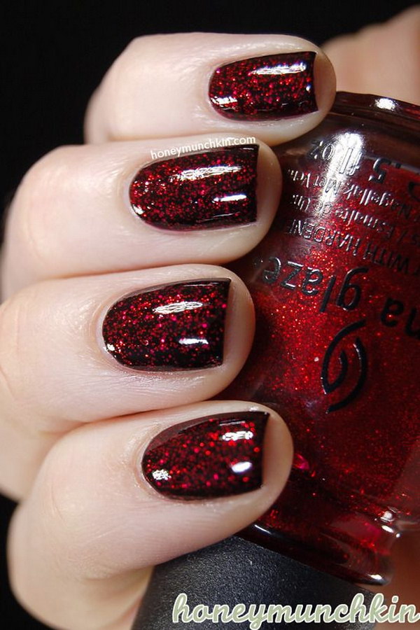 Black Nails with Red Glitter Coating. 