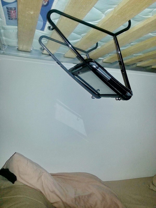 Suspend your tablet over your bed with coat hangers.