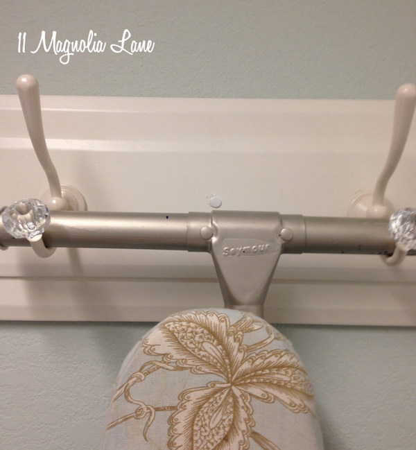 Get The Iron Board Off The Floor With Two Decorative Hooks 