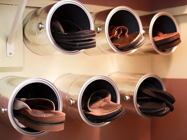 Paint Cans Nailed to the Wall for Shoe Storage. 