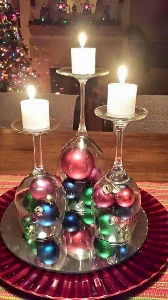 DIY Upside Down Wine Glasses With Small Christmas Ornaments In Bottom And Candles On Top.