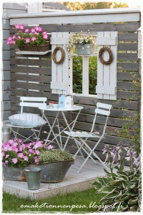 Create a Sitting Area with Pallet Wood and Old Shutters.