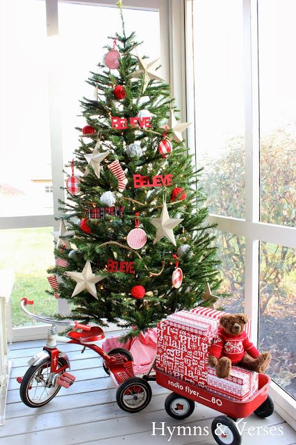 Kid's Red Wagon Filled With Packages Sit As Christmas Tree Stand.