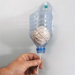 Recycle plastic bottles for ball of yarn storage.